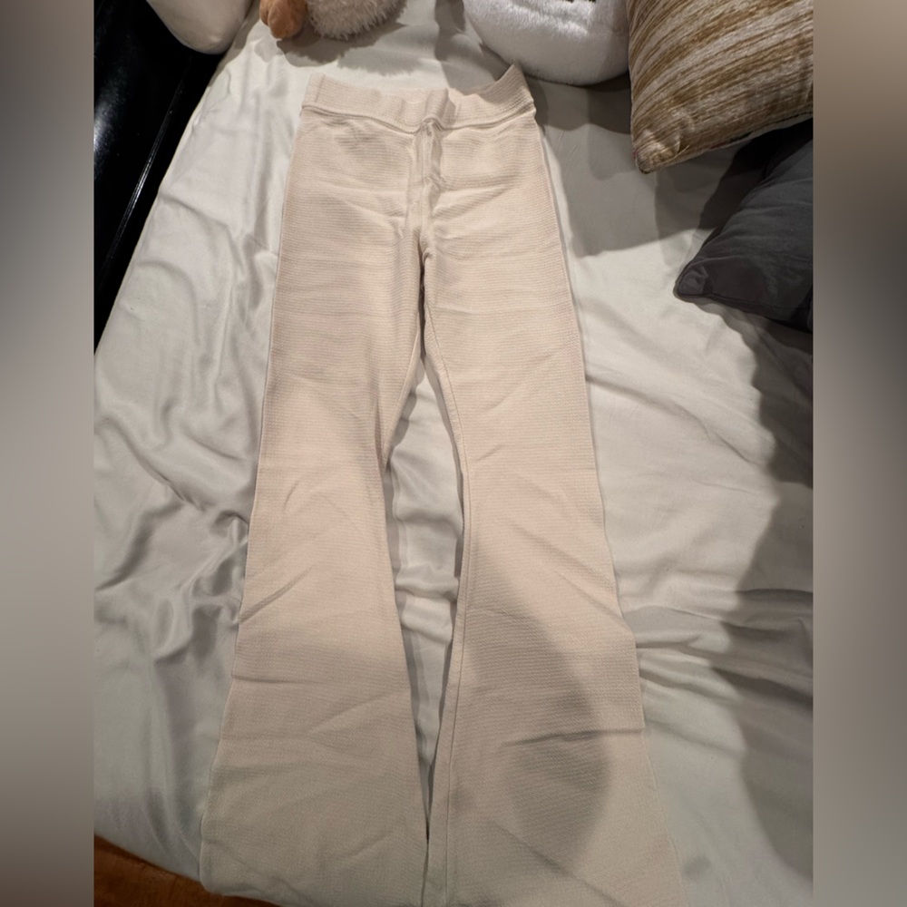 Knit cream colored flare leggings with back pockets
